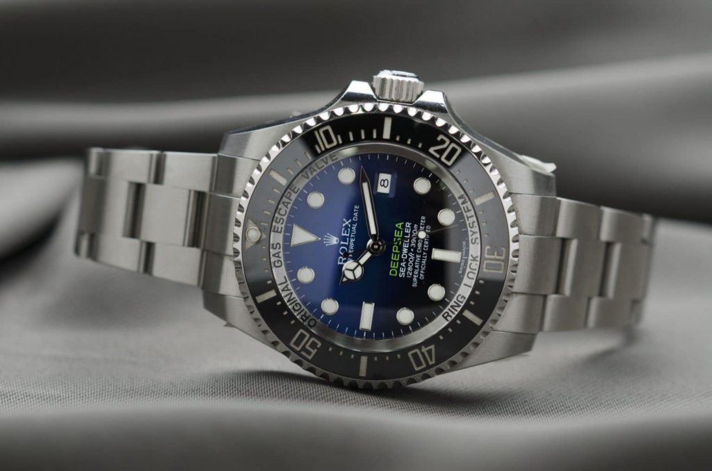 Rolex deepsea watch with silver band an blue face