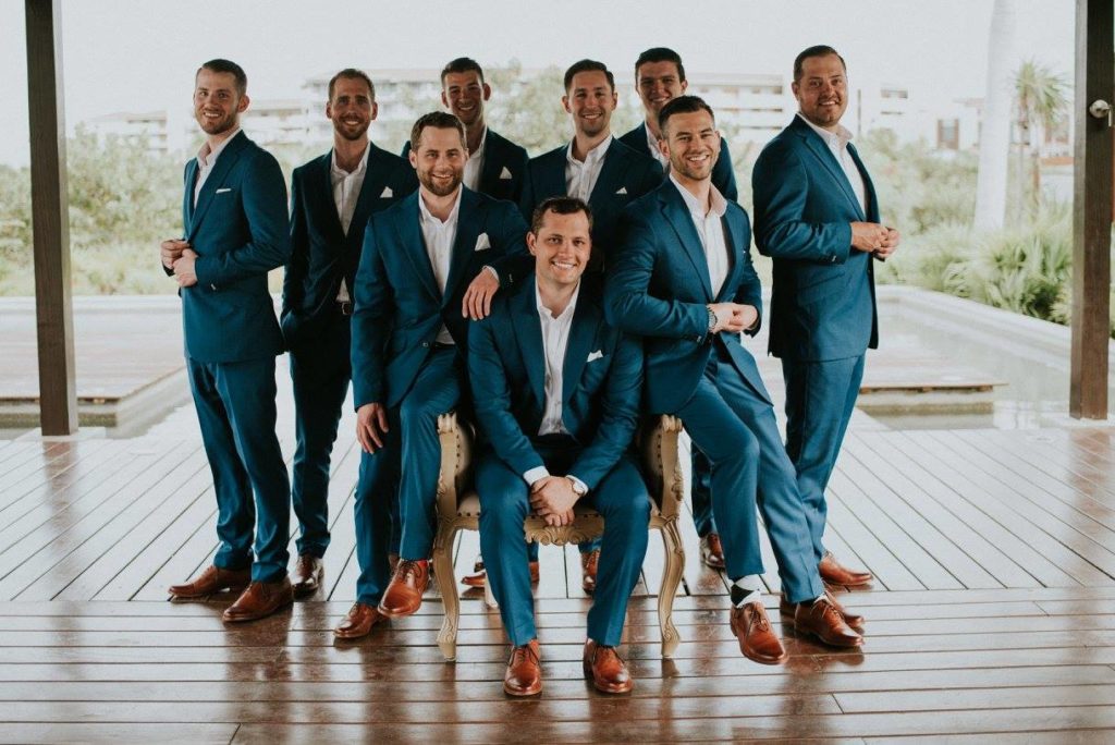 A wedding party in elegant groomsman attire by Hartter Manly