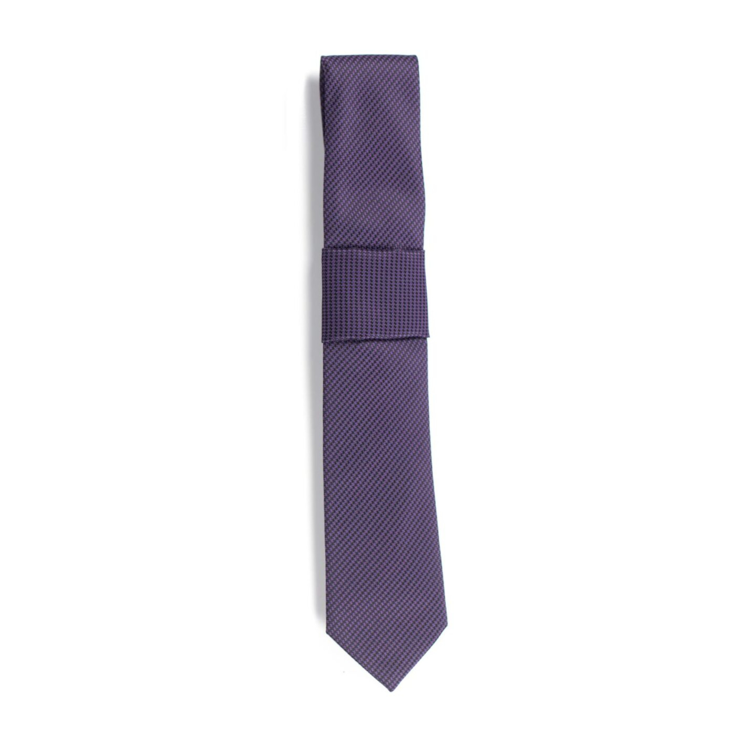 A purple houndstooth patterned tie on a white background