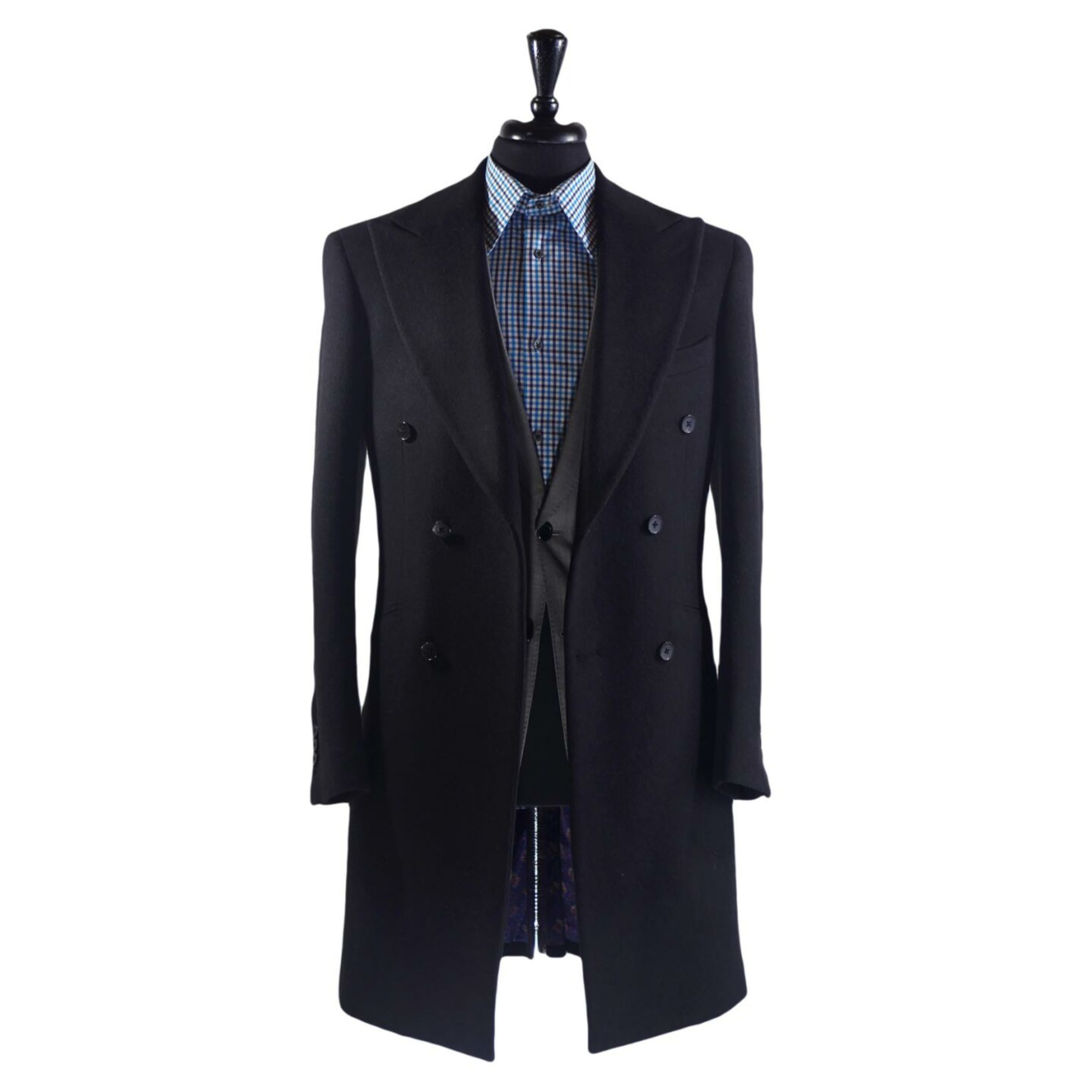 Overcoats - Churchill Classic. A black knee length overcoat on a body form with a blue checkered shirt on a white background