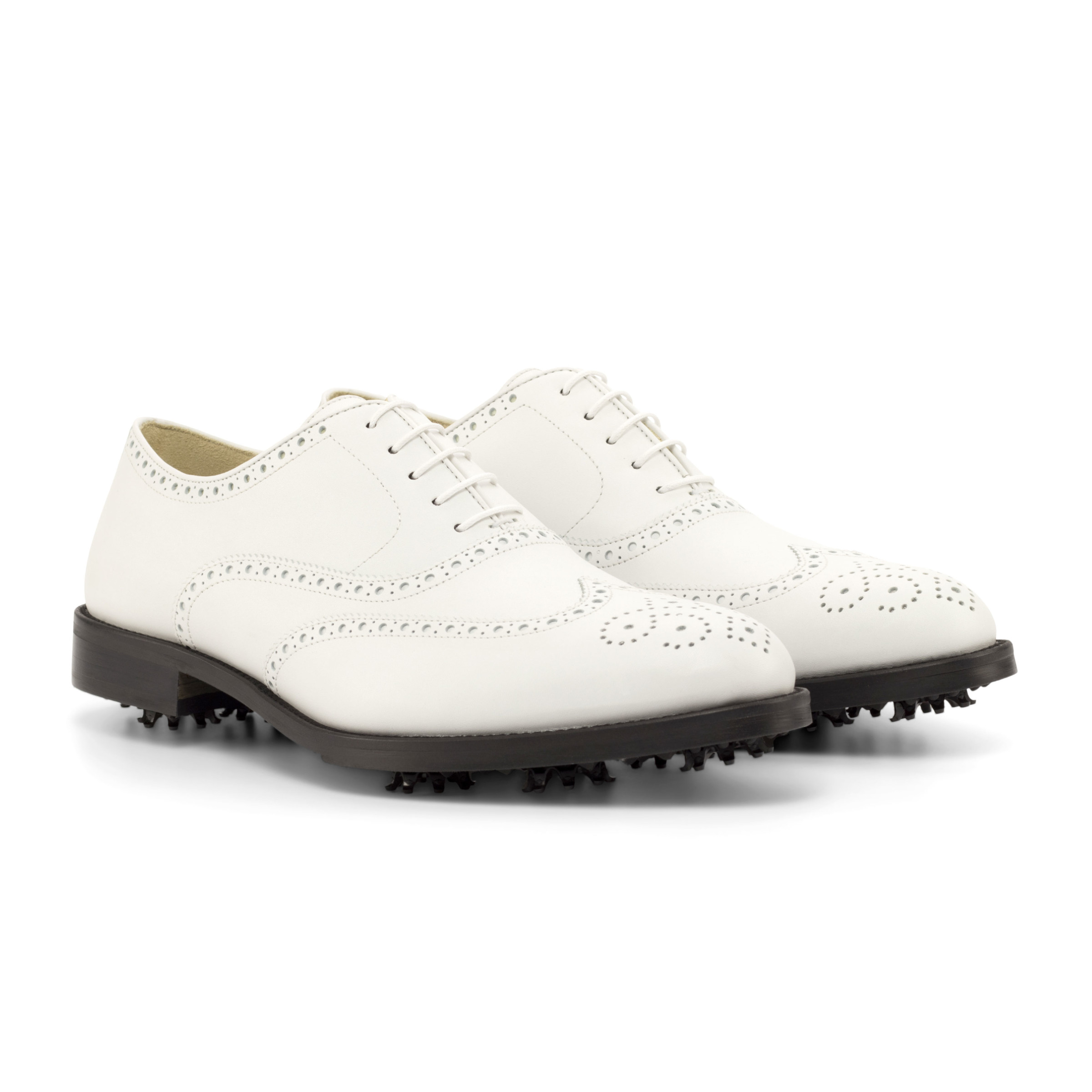 The Brogue Golf Shoe: White. White Box calf leather golf shoes with toe embellishments on a white background