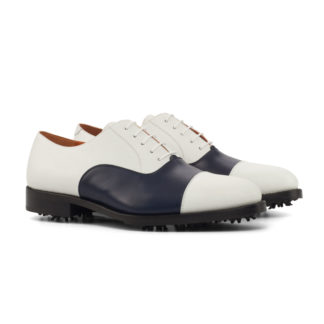 The Swinger Golf Shoe: Navy/White. Navy and white box calf leather golf shoes on a white background.