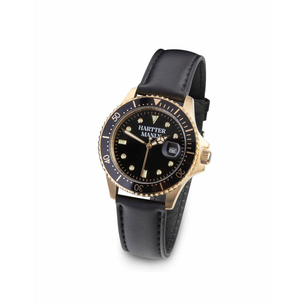 A black and gold watch face with a black bezel and black leather strap on a white background