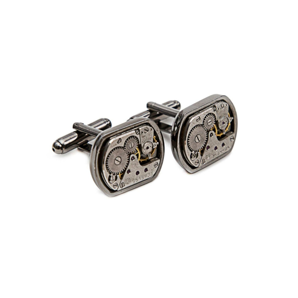 Rectangle tungsten cufflinks with visible gears on a white background