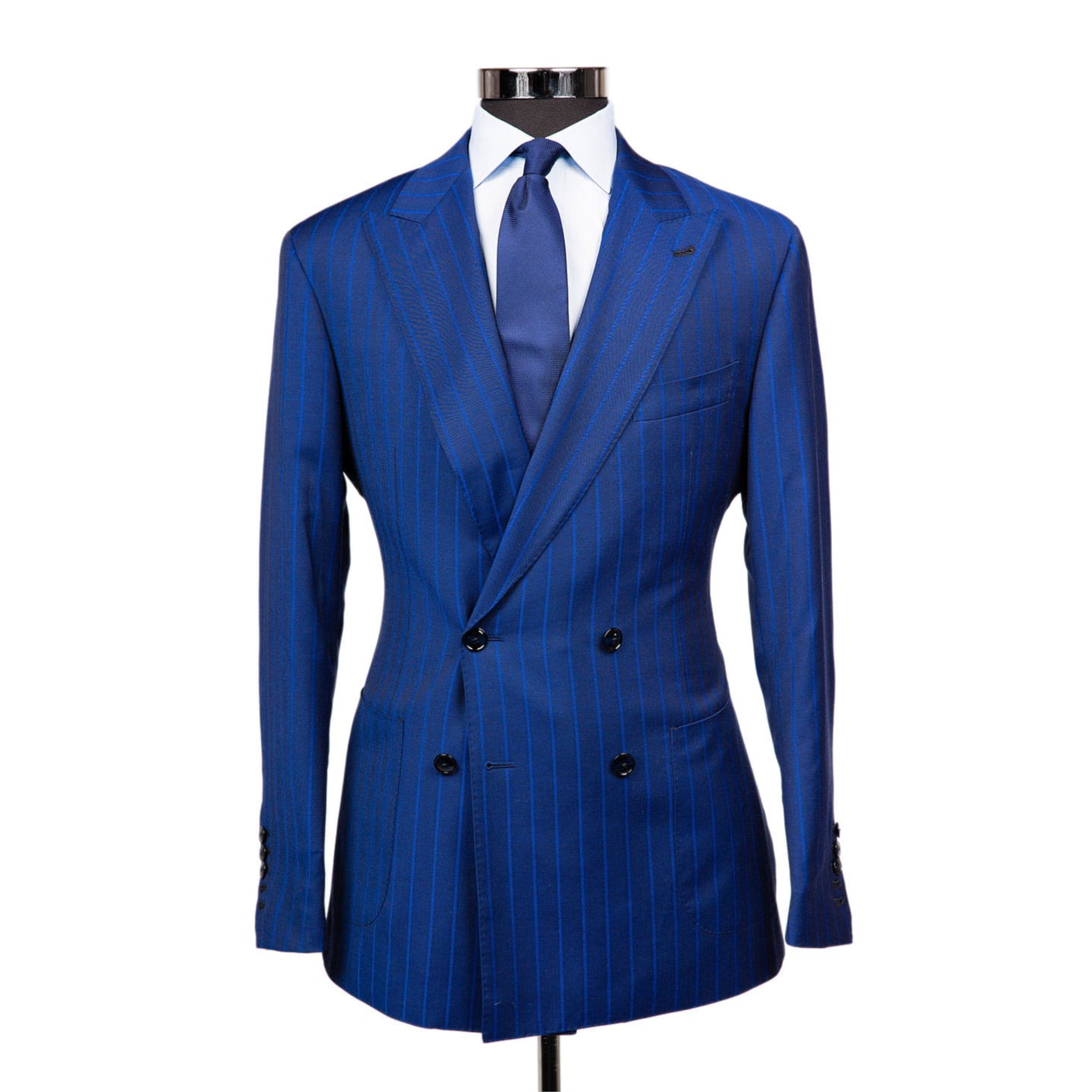 A navy suit jacket with cobalt pinstripes on a body form with a white shirt and cobalt blue tie on a white background