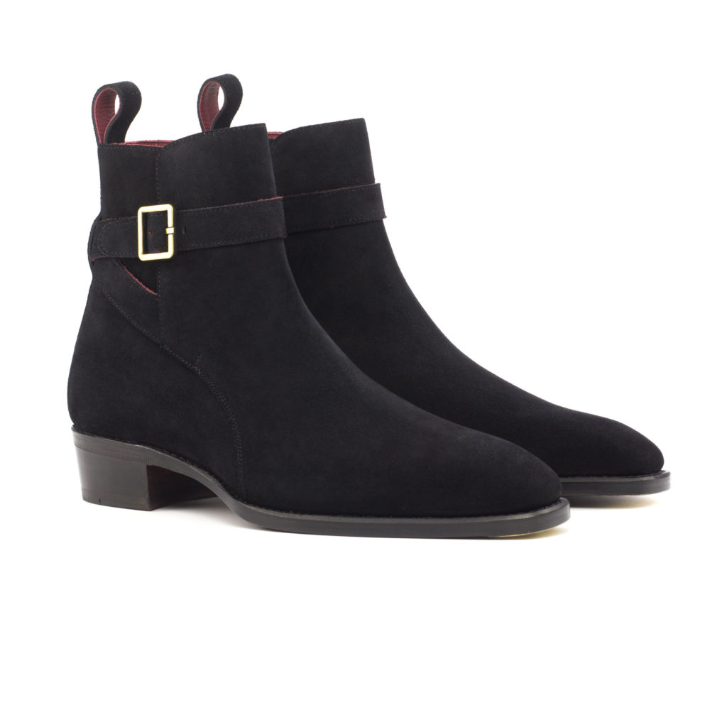 The Stallion: Nox Suede. Black luxury suede riding style ankle boots with strap and buckle on a white background