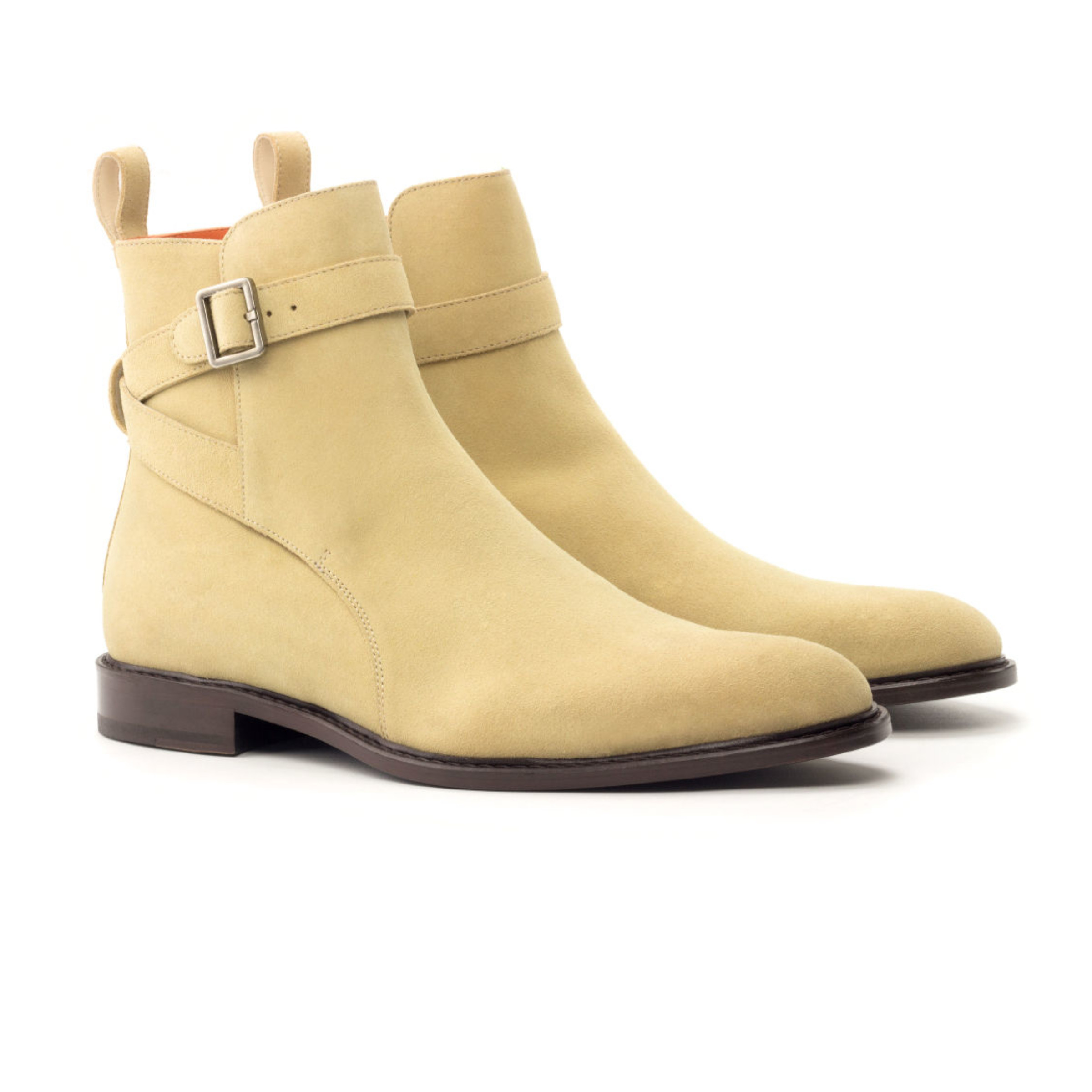 The Stallion: Camel Suede. Sand colored luxury suede ankle style riding boot with strap and buckle on a white background