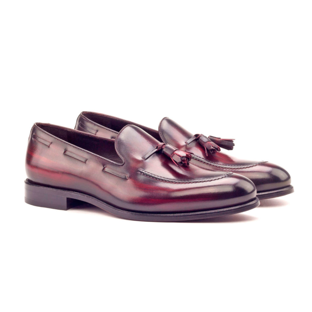 The Richmond: Tasseled Burgundy. Burgundy patina loafers against white background.
