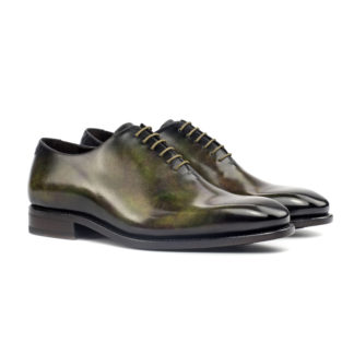 The Totum: Green Patina. Whole cut oxfords in green museum patina against white background.