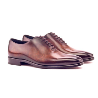The Totum: Brown Patina Monti. Whole cut oxfords in brown marble patina against white background.