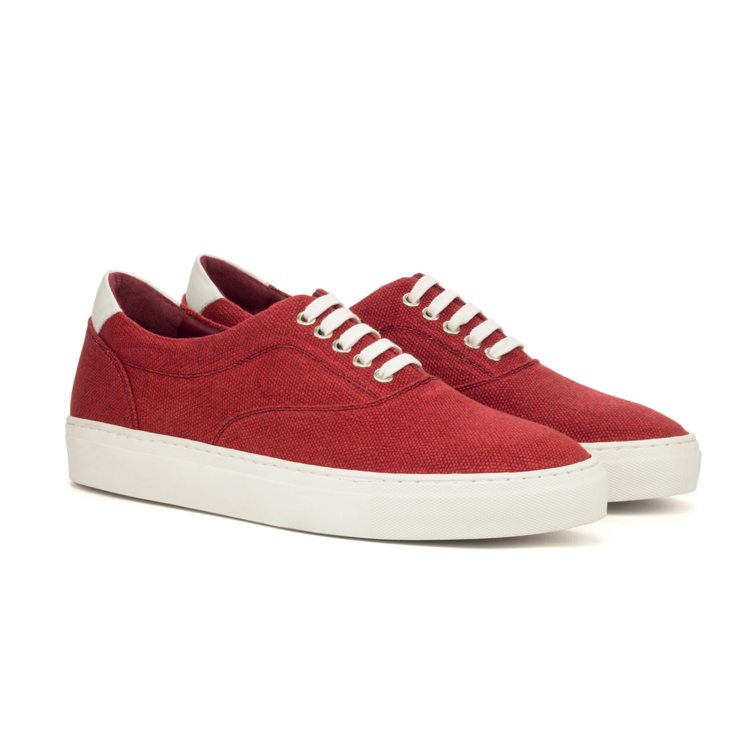 The Mariner: Scarlet Canvas. Red Linen and White box calf sneaker style shoe with white laces and soles, on a white background