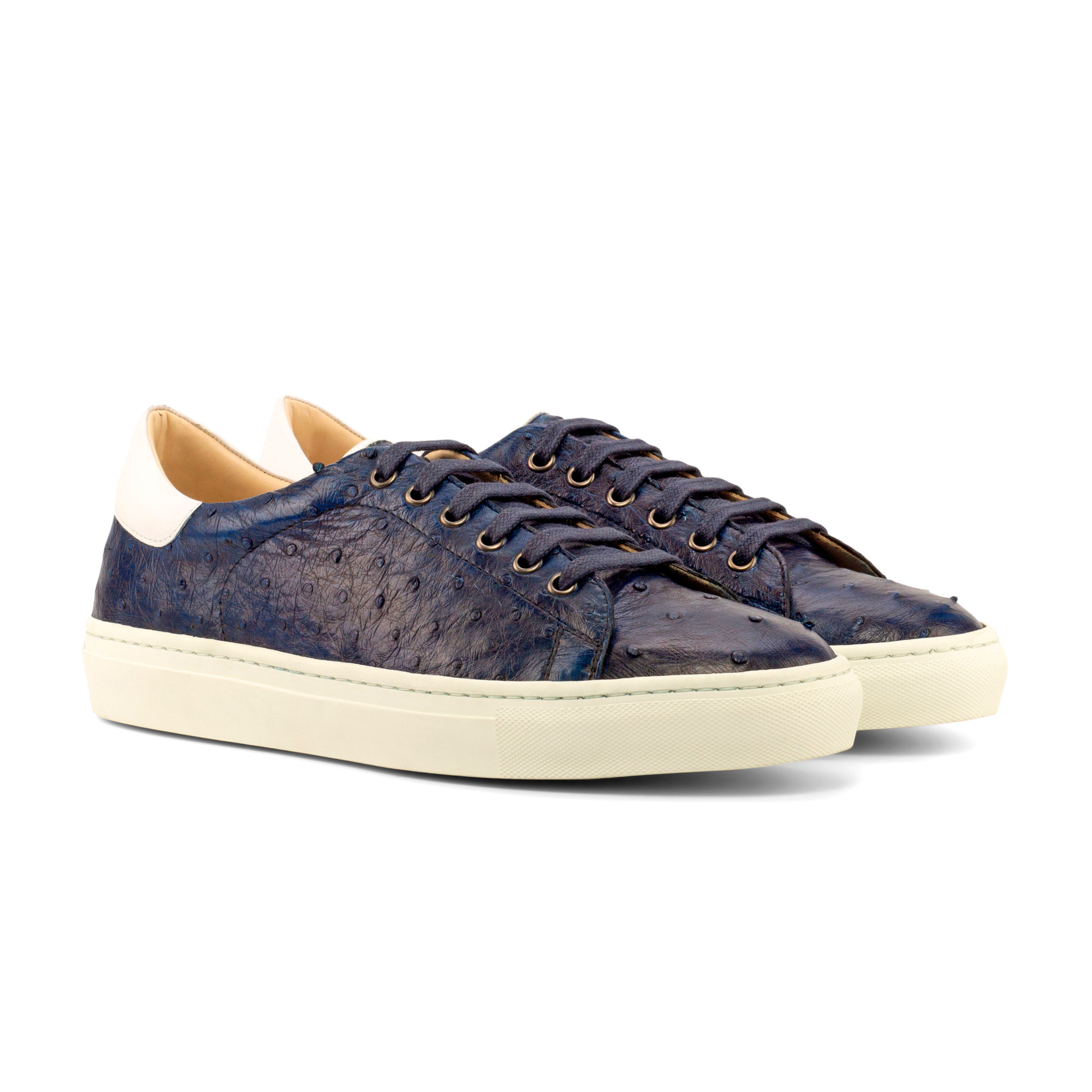 The Plimsoll: Ostrich. White box calf and navy exotic ostrich lace up trainer style shoes with white soles on a white background