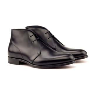 The Arborist: Polished Black. Front side facing view of black polished calf leather ankle style boots with laces on a white background