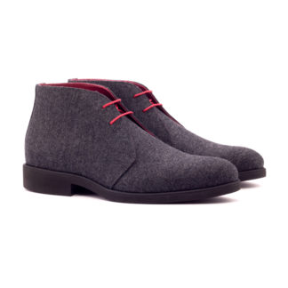 The Arborist: Grey Flannel. Front side view of dark grey flannel ankle style boots with orange laces on a white background
