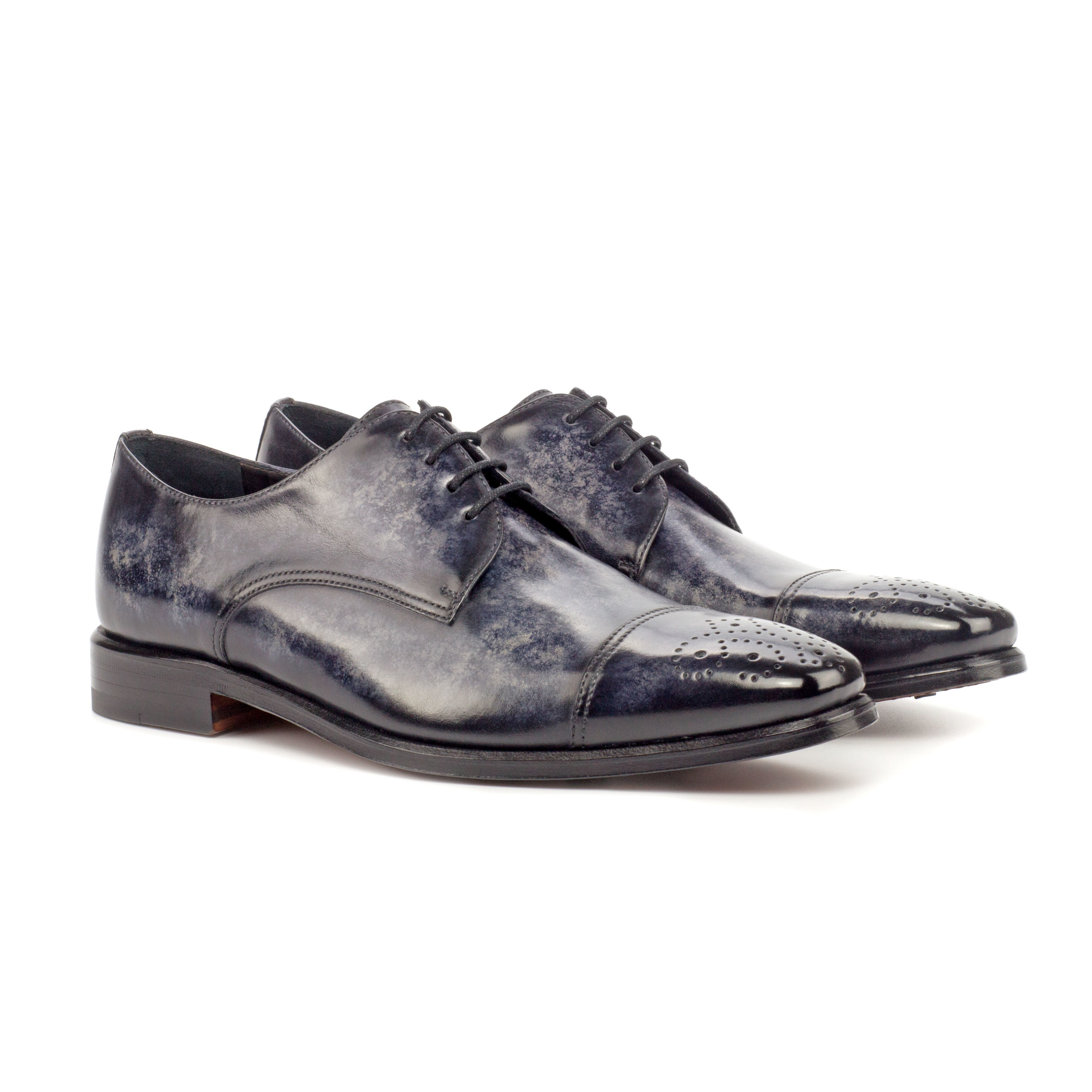 The Latus: Gray Patina Brogue. Front side view of black painted croco and grey patina leather men's style lace up dress shoes on a white background