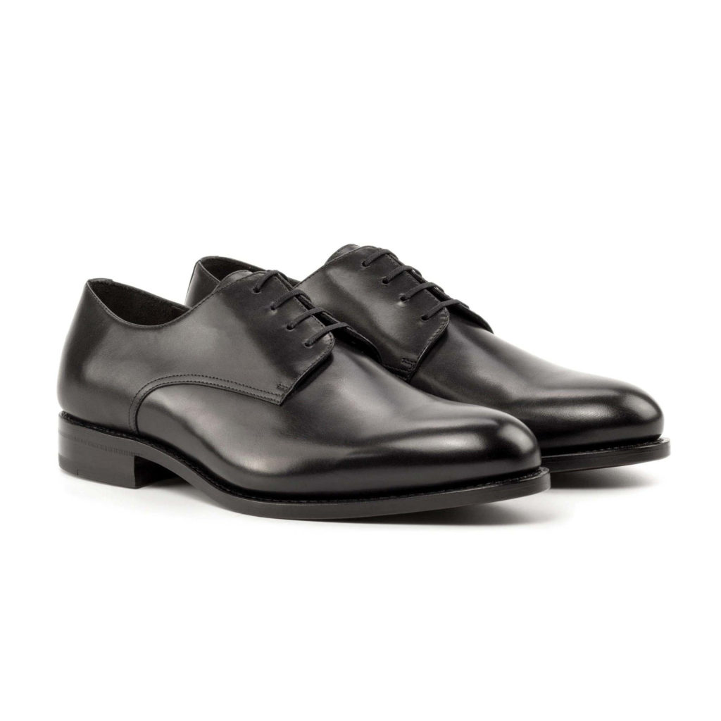 The Latus: Black Box Calf. Front side view of black box calf leather men's style dress shoes with laces on a white background