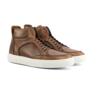 Front side view of High Top: Camel Grain shoe. medium brown painted calf, dark brown painted calf, med brown pebble grain leather high top style sneaker with white soles on a white background