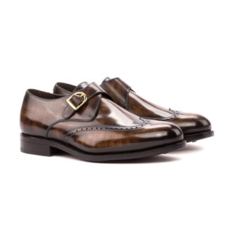 The Abbot: Chestnut Patina Brogue. Front view of Brown Patina leather single strap monk style shoes on a white background