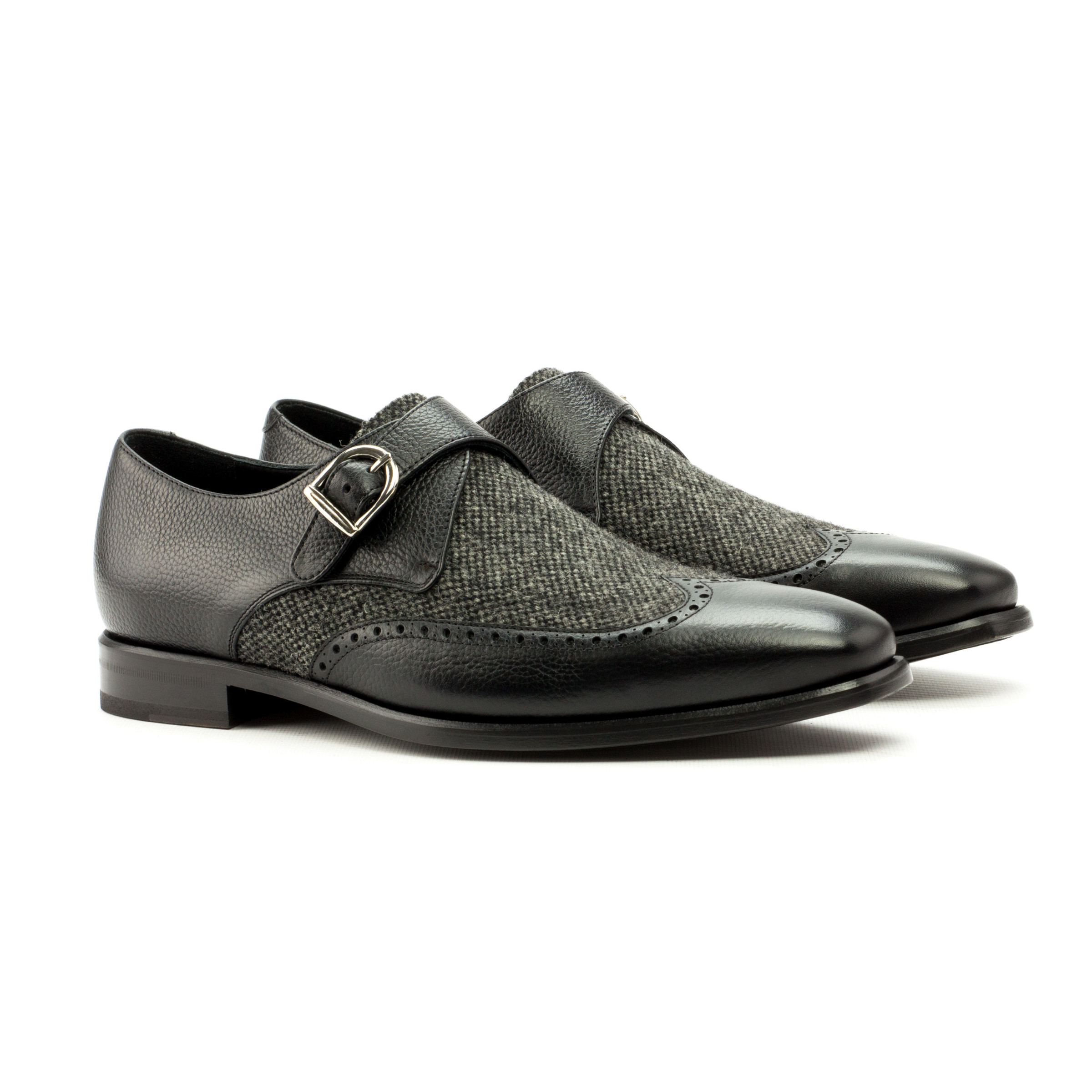 The Abbot: Black Calf/Nailhead. front side view of Nailhead Sartorial, black painted full grain leather single strap monk style shoes on a white background